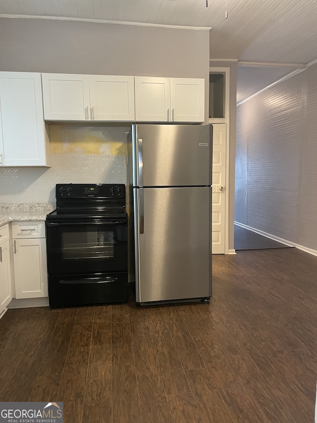 kitchen with stainless steel fridge, dark hardwood / wood-style flooring, black electric range oven, light stone counters, and white cabinetry