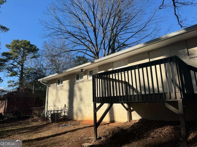 view of side of property featuring central AC unit