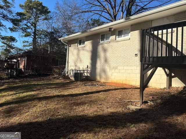 view of side of property featuring central air condition unit