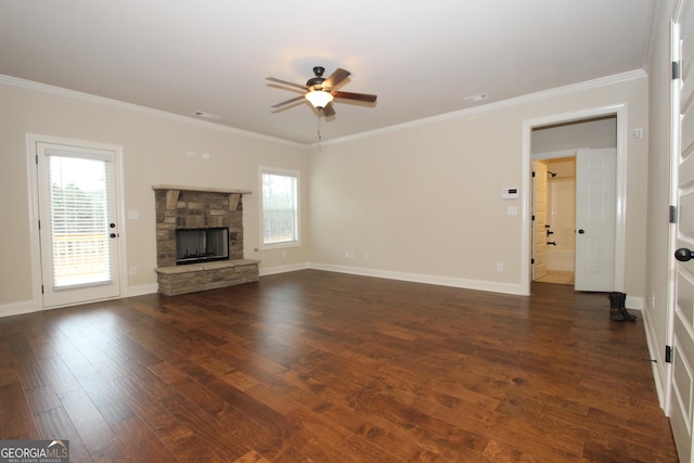 unfurnished living room with ceiling fan, a fireplace, dark hardwood / wood-style flooring, and crown molding