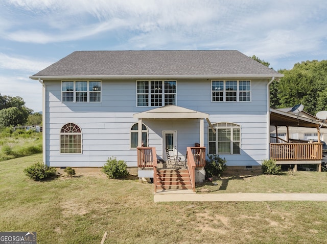 view of front of property featuring a deck and a front lawn