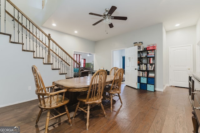 dining area featuring ceiling fan and dark hardwood / wood-style floors