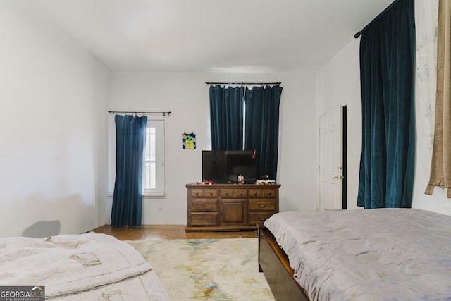 bedroom with hardwood / wood-style floors