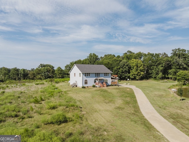 view of front of house with a front lawn and a deck