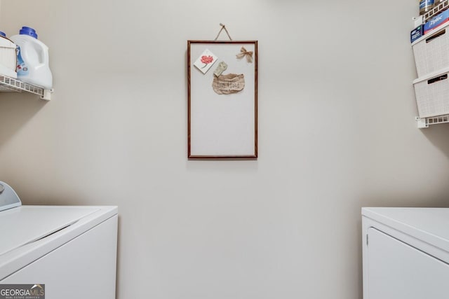 washroom featuring independent washer and dryer