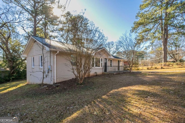 view of property exterior with a yard