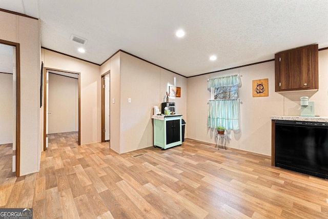 kitchen with a textured ceiling, dishwasher, light hardwood / wood-style floors, and crown molding