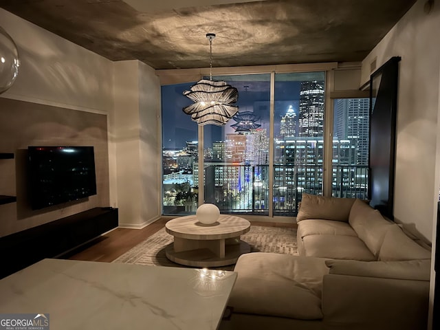 interior space with wood finished floors and a notable chandelier