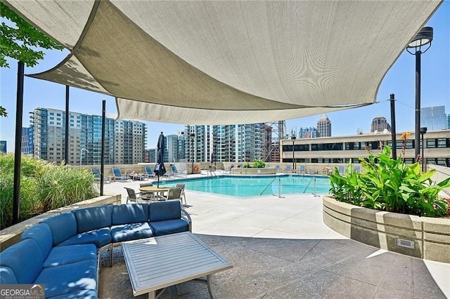 view of pool featuring a patio and outdoor lounge area