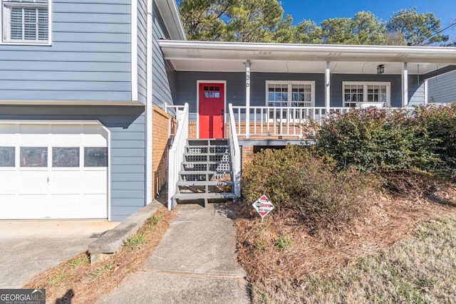 view of exterior entry with a garage