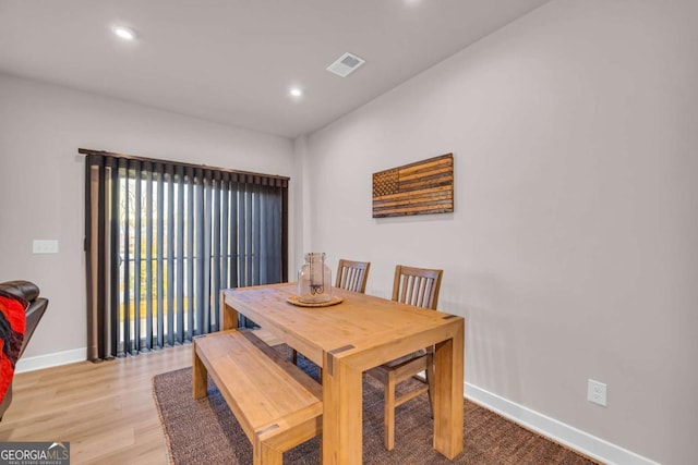 dining space with light hardwood / wood-style flooring