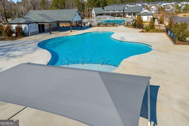 view of swimming pool with a patio