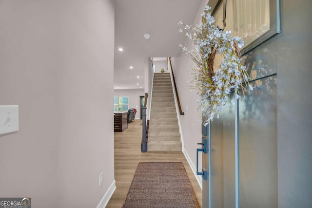 stairway with wood-type flooring