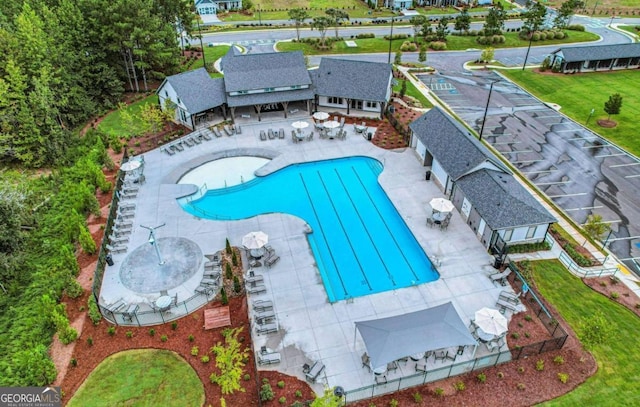 view of pool featuring a grill