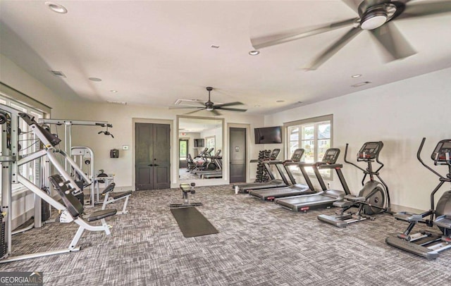 workout area with carpet and ceiling fan