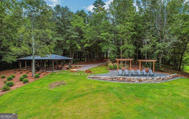 view of yard featuring a gazebo and a pergola