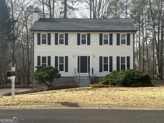 colonial house featuring a garage