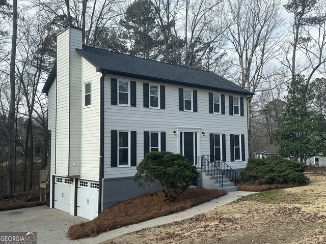 colonial-style house featuring a garage