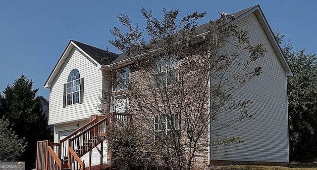 view of side of home featuring a garage