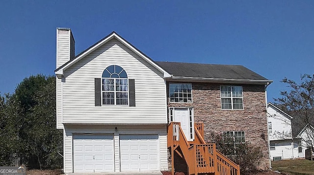 raised ranch featuring a garage