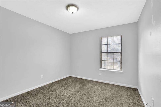 unfurnished room with carpet floors