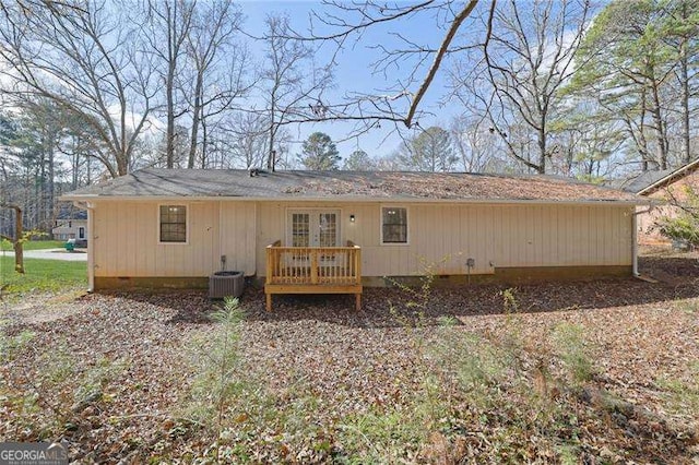 rear view of house with french doors and central AC