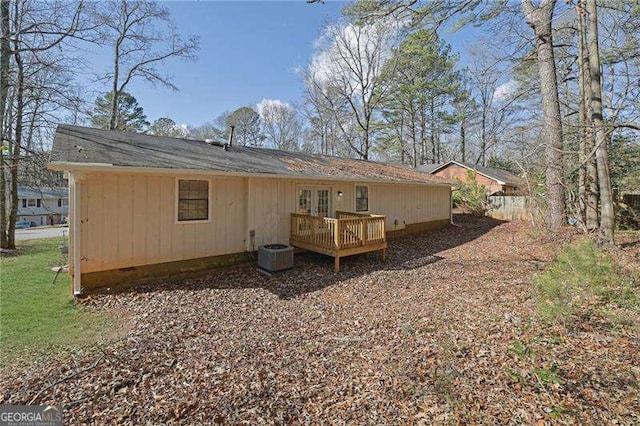 back of property featuring cooling unit and a deck