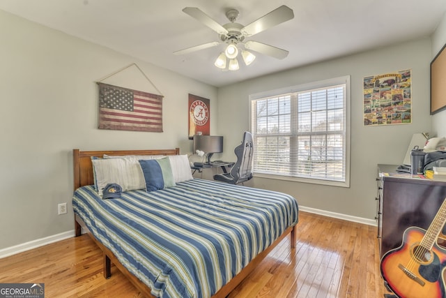 bedroom with light wood-type flooring and ceiling fan