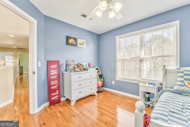 bedroom featuring light hardwood / wood-style floors and ceiling fan