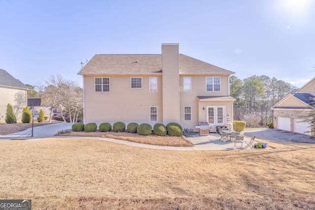 back of property with a patio