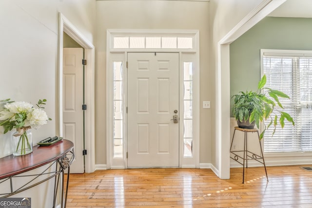 foyer with light hardwood / wood-style floors