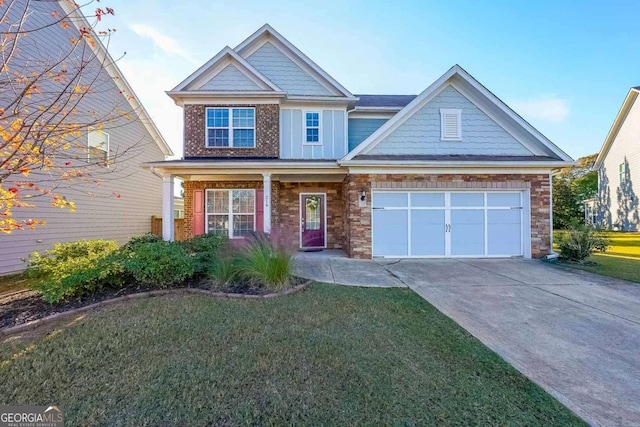 craftsman house with a front lawn and a garage