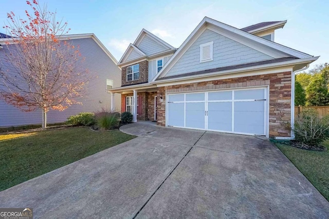 view of front of house with a front lawn and a garage