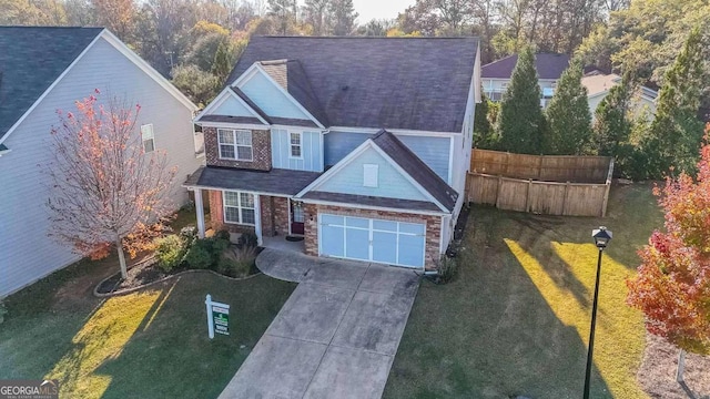 view of front of house featuring a front yard and a garage