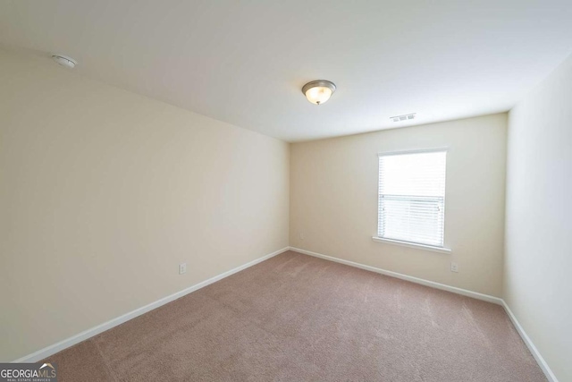 unfurnished room with carpet floors