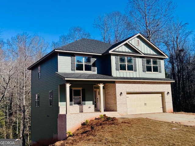 view of front of house with a porch and a garage