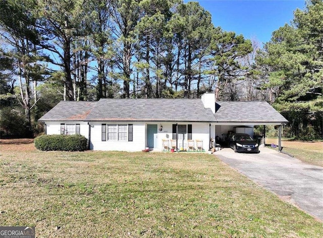 ranch-style house with a front yard and a carport