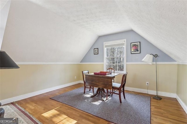 301 Benson Rd, Dallas, GA 30132 - dining space with a textured ceiling, hardwood / wood-style flooring, and vaulted ceiling