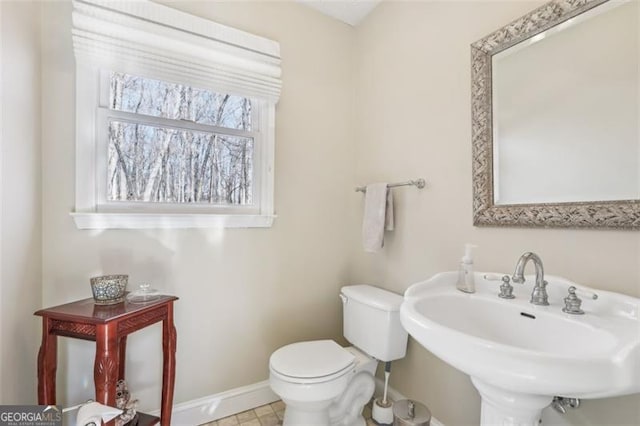 301 Benson Rd, Dallas, GA 30132 - bathroom featuring tile patterned flooring, toilet, and sink