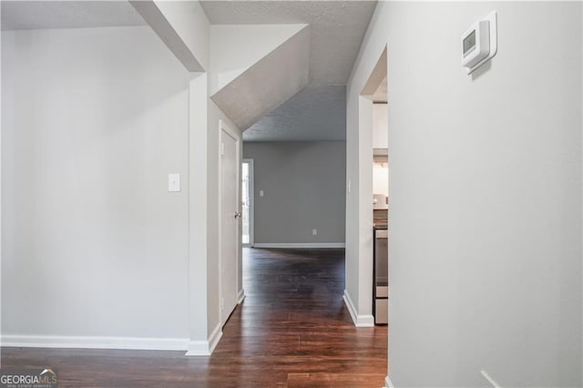 corridor featuring dark wood-type flooring