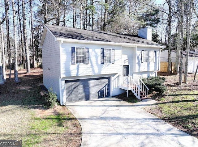 raised ranch featuring a garage