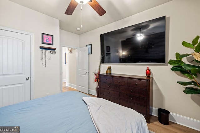 bedroom featuring ceiling fan and light hardwood / wood-style flooring