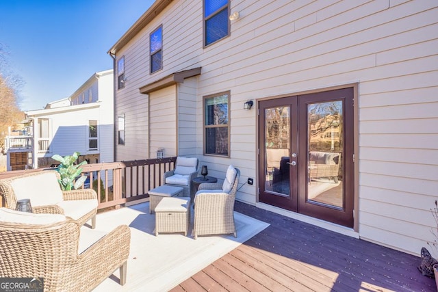 deck featuring outdoor lounge area and french doors