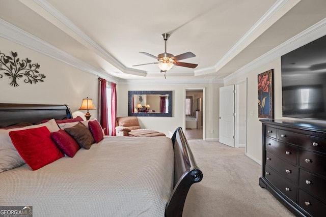 bedroom with a tray ceiling, ceiling fan, crown molding, and light carpet