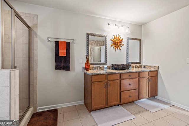 bathroom featuring tile patterned flooring, vanity, and an enclosed shower