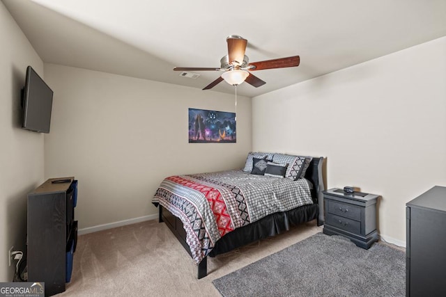 bedroom featuring ceiling fan and light colored carpet