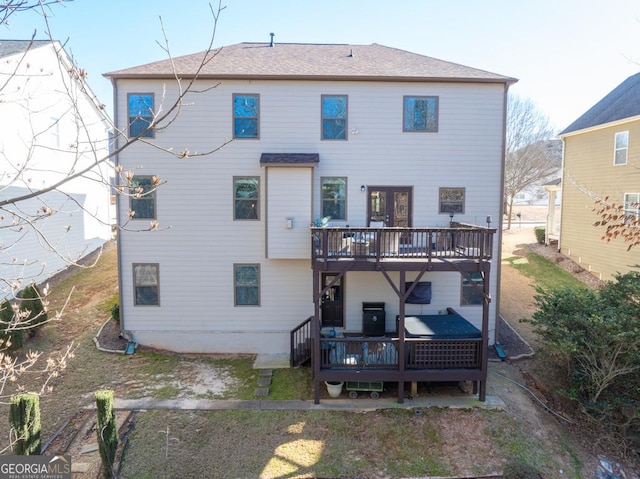 rear view of house with a deck