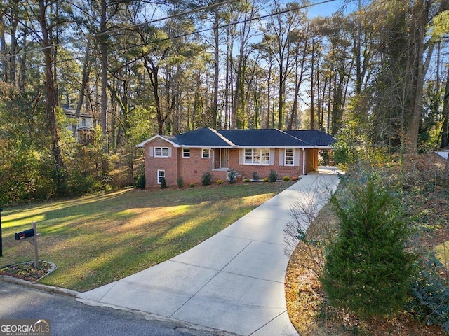 ranch-style home featuring a front yard