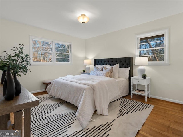 bedroom with hardwood / wood-style floors