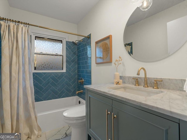 full bathroom with vanity, shower / tub combo, and toilet